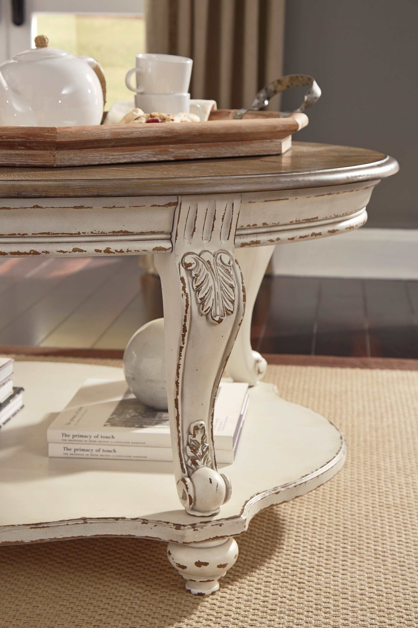 Realyn White/Brown Oval Coffee Table