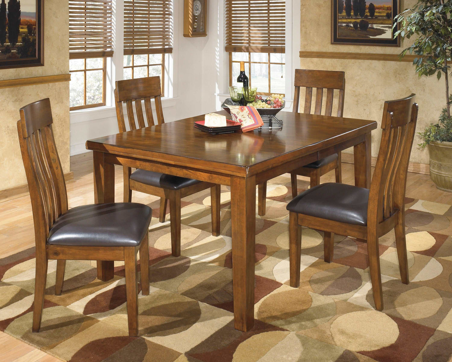 Ralene Medium Brown Dining Table w/ Butterfly Extension