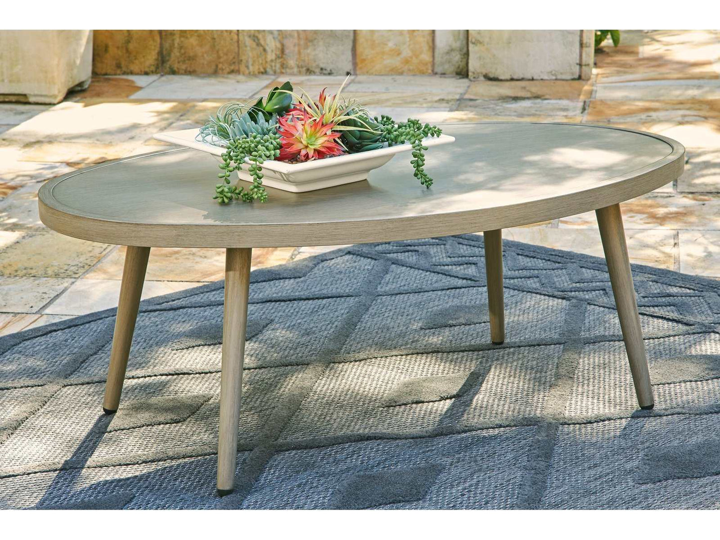 Swiss Valley Beige Oval Outdoor Coffee Table